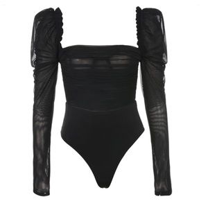 Sheer black bodysuit from mussecco with puff sleeves